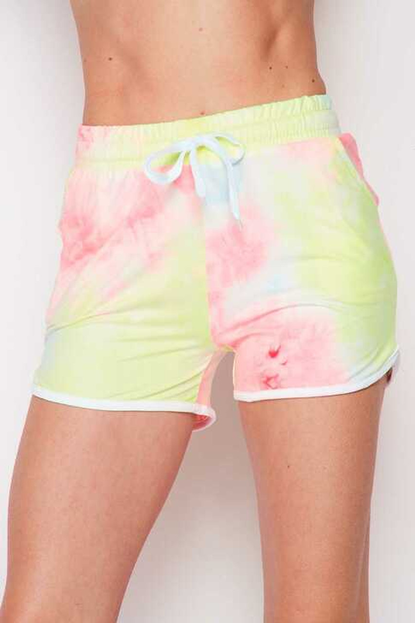 Front of Buttery Soft Pink and Yellow Tie Dye Side Striped Drawstring Waist Dolphin Shorts with a gorgeous pastel design
