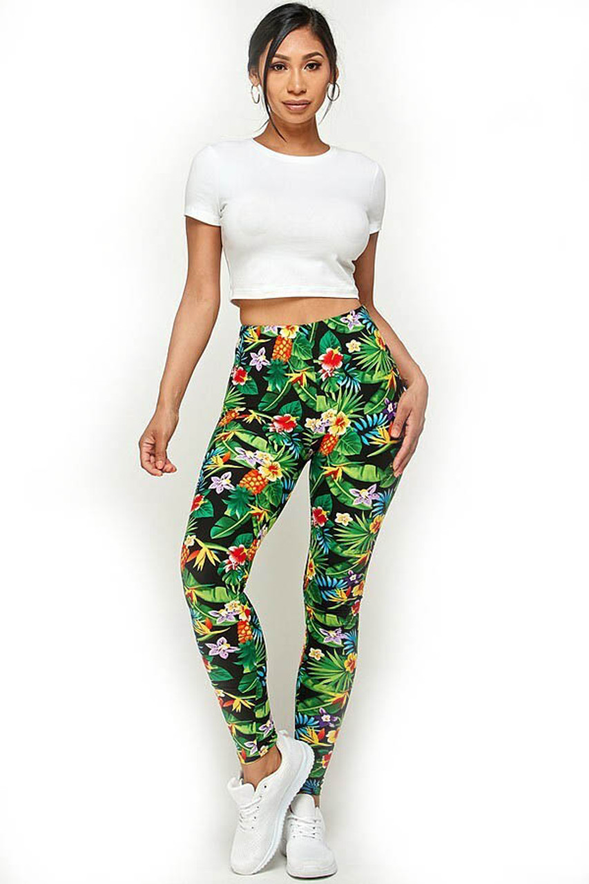Front of Buttery Soft Tropicana Floral Leggings shown styled with a white crop top and white sneakers.