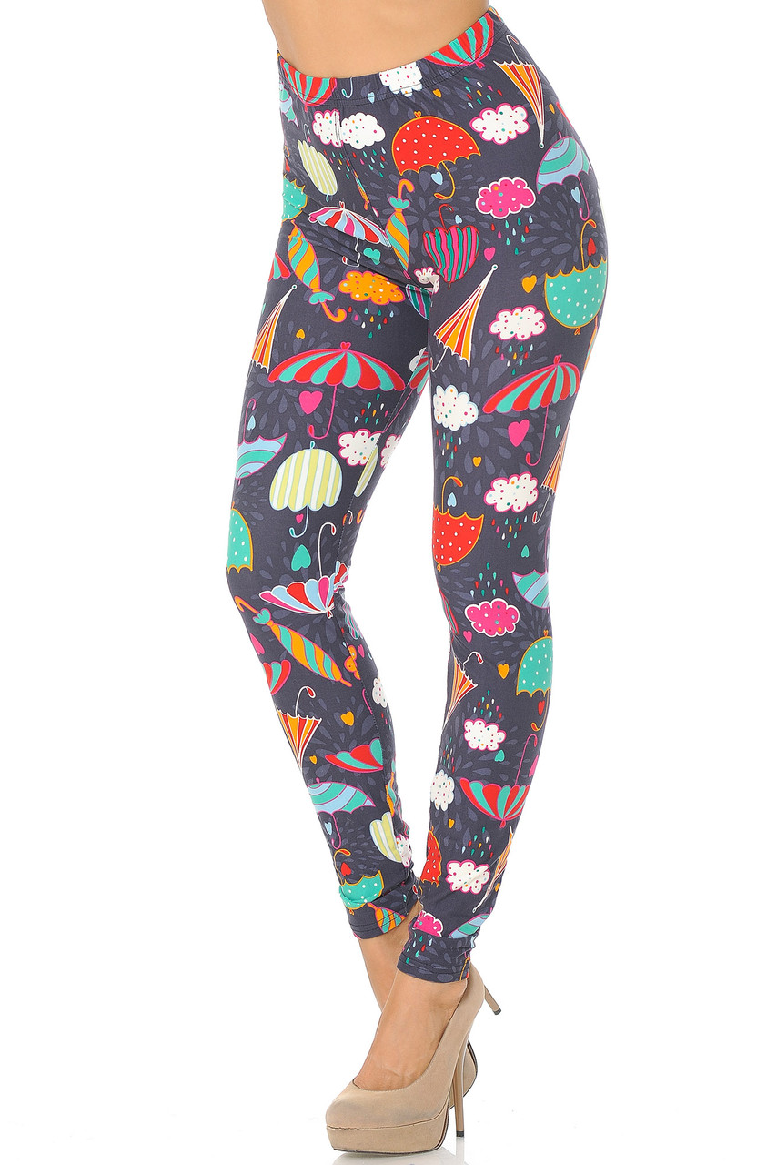 Angled front view image of Buttery Smooth Vintage Umbrella Extra  Plus Size Leggings featuring a colorful umbrella design on a charcoal background.