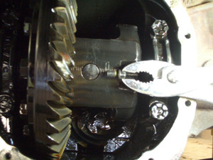 Q:  Can you extract the broken differential pinion shaft lock bolt without taking off the rear end?