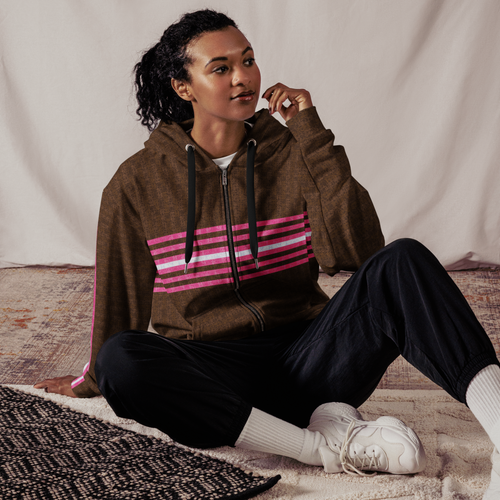 Woman wearing a brown zip-up hoodie with multiple pink and white stripes on chest & sleeves Woman wearing a brown zip-up hoodie with multiple pink and white stripes on chest & sleeves