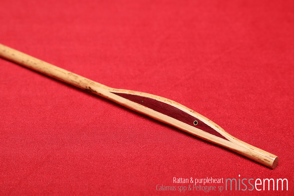 Handcrafted bdsm toys | Rattan spanking cane | By Sydney fetish artisan Miss Emm | The shaft is rattan and the handle is made from purpleheart with brass details. | Perfect for impact play, bdsm corporal punishment scenes, and all sorts of kinky fun in the hands of a Mistress, Master, Domina, Dom, Top, or anyone who enjoys caning.