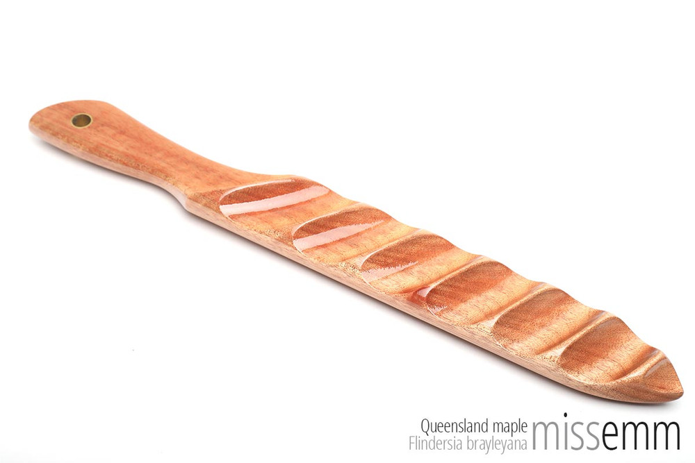 Handcrafted kink toys | Ridged wood spanking paddle | By fetish artisan Miss Emm | This stunning and unique spanking paddle is made from Queensland maple with brass details. It has a ridged and a domed face to provide two very different impact sensations.