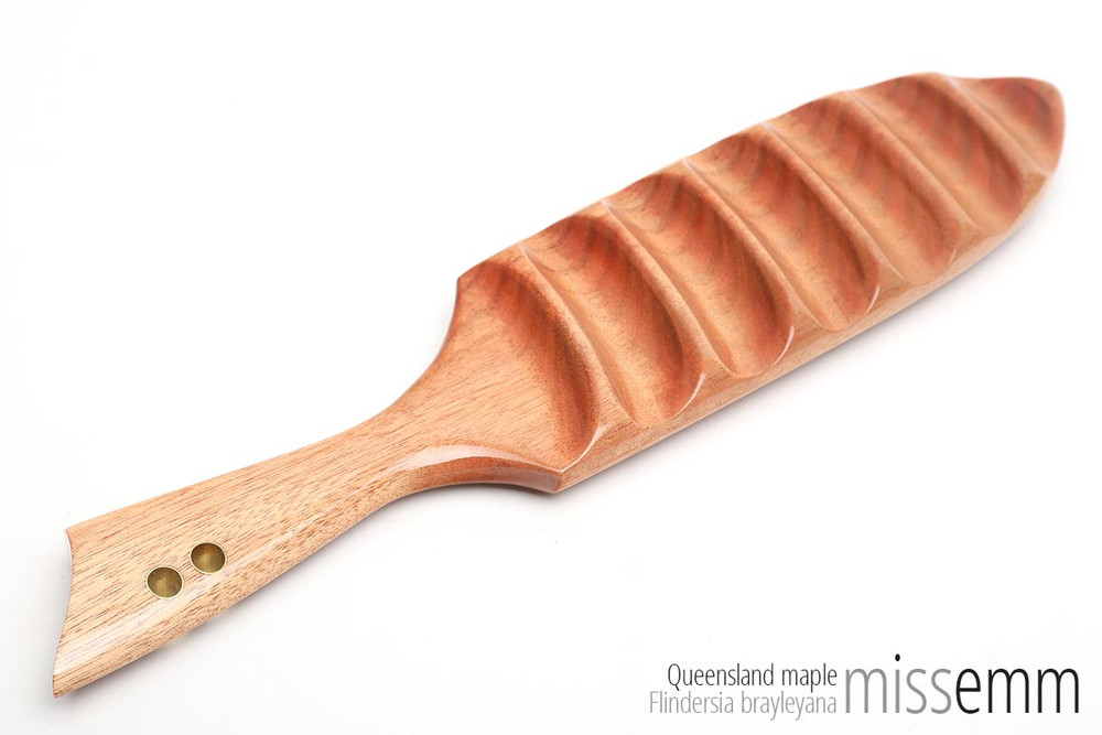 Handmade spanking toys | BDSM wooden paddle | Created by Australian kink artisan Miss Emm. This paddle is made from Queensland maple with brass details. It features a smooth face and ridged face which allows for two very different sensations. If you love unique fetish toys then this spanking paddle will be right at home in your fetish toy box.