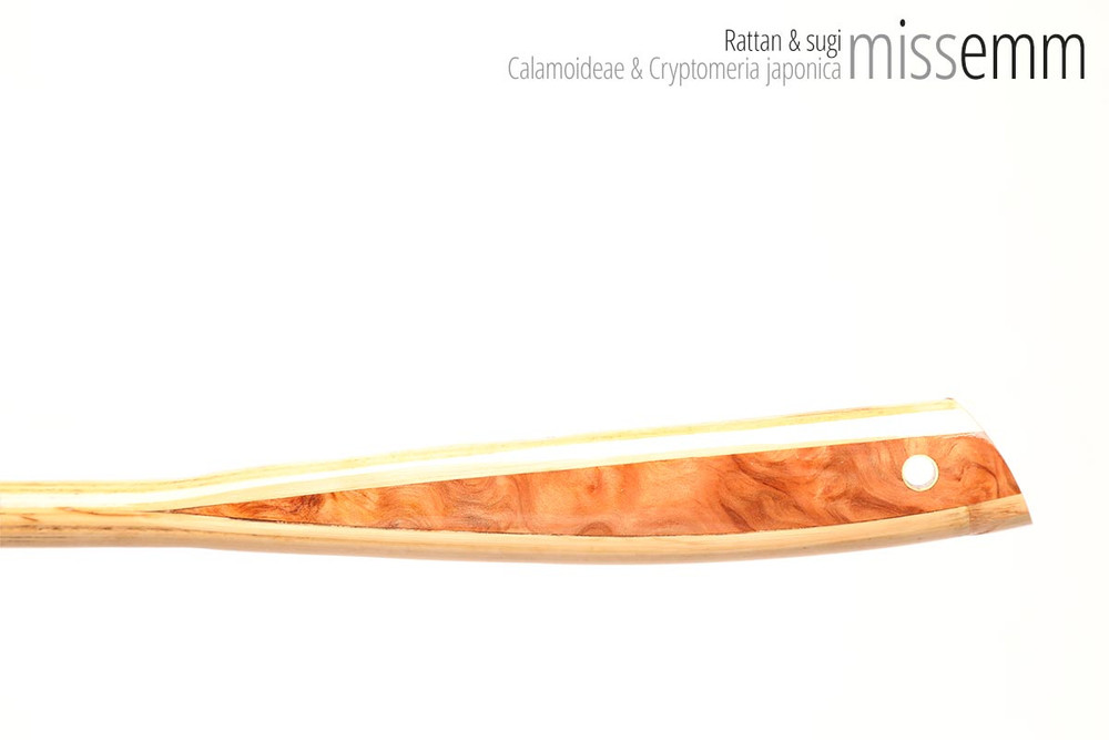 Unique handcrafted bdsm toys | Rattan spanking cane | By kink artisan Miss Emm | The shaft is rattan cane and the handle has been handcrafted from Japanese cedar with brass details.