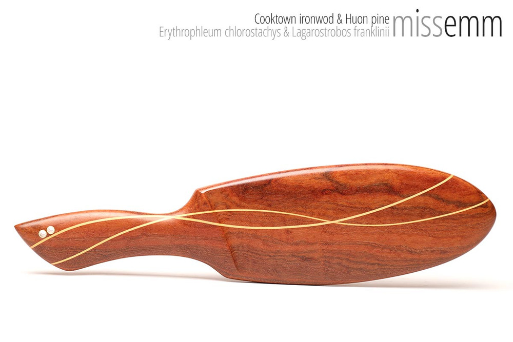 Unique handcrafted bdsm toys | Heavy wooden spanking paddle | By kink artisan Miss Emm | Made from Cooktown ironwood and Huon pine with brass details and a hand rubbed oil finish.