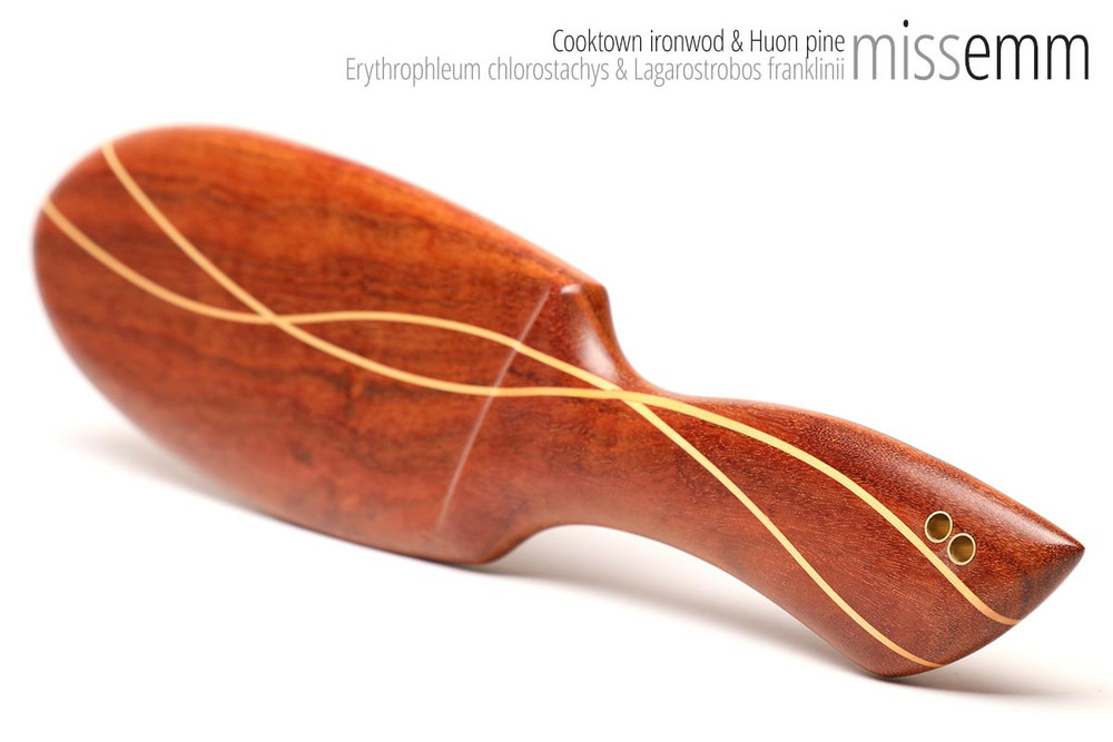 Unique handcrafted bdsm toys | Heavy wooden spanking paddle | By kink artisan Miss Emm | Made from Cooktown ironwood and Huon pine with brass details and a hand rubbed oil finish.
