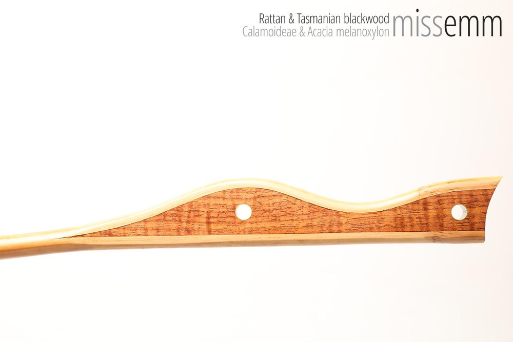 Unique handcrafted bdsm toys | Rattan spanking cane | By kink artisan Miss Emm | The shaft is rattan cane and the handle has been handcrafted from Tasmanian blackwood with brass details.