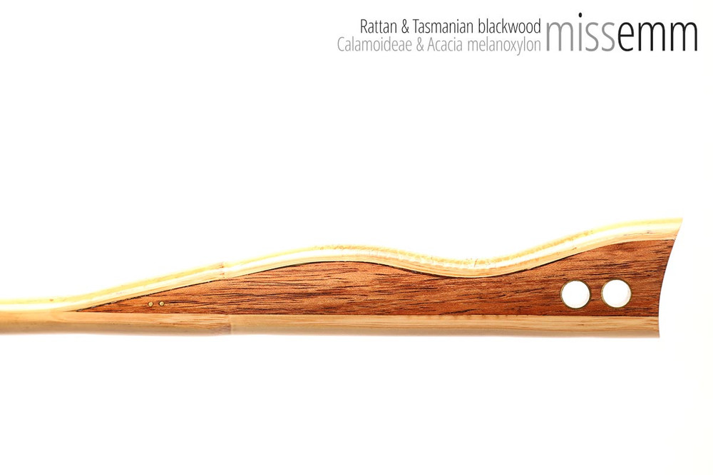 Unique handcrafted bdsm toys | Rattan spanking cane | By kink artisan Miss Emm | The shaft is rattan cane and the handle has been handcrafted from Tasmanian blackwood with brass details.