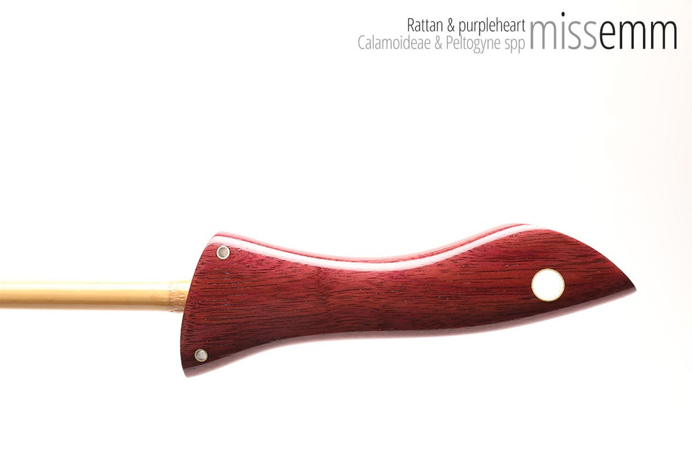 Unique handcrafted bdsm toys | Rattan spanking cane | By kink artisan Miss Emm | The shaft is rattan cane and the handle has been handcrafted from purpleheart with brass details.