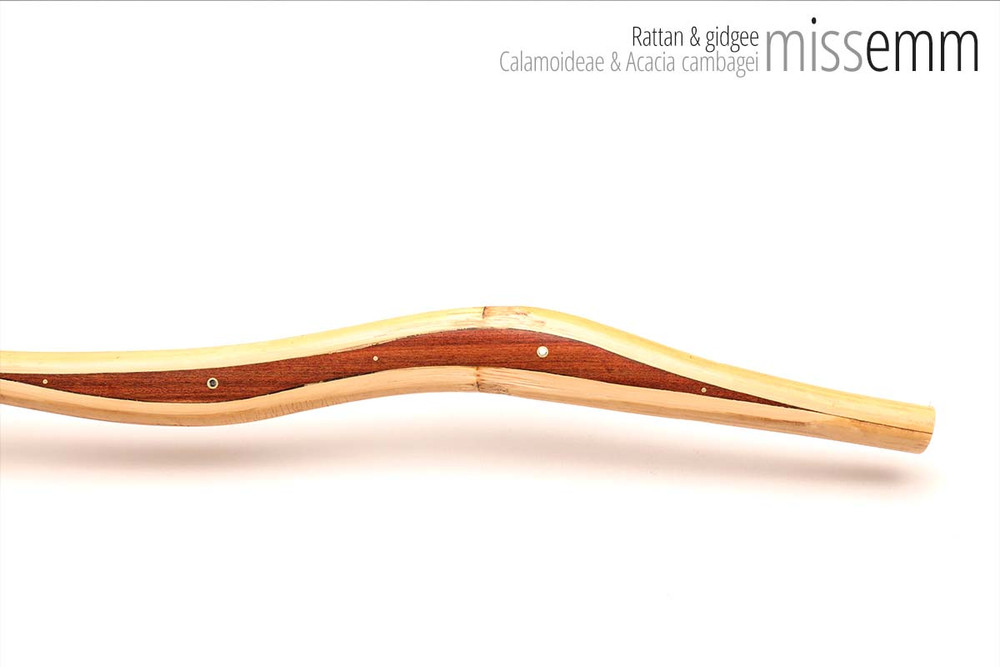 Unique handcrafted bdsm toys | Rattan spanking cane | By kink artisan Miss Emm | The shaft is rattan cane and the handle has been handcrafted from gidgee with brass details.