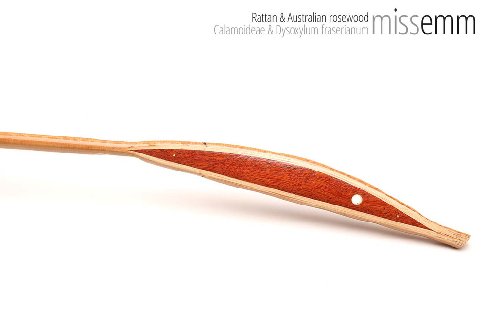 Unique handcrafted bdsm toys | Rattan spanking cane | By kink artisan Miss Emm | The shaft is rattan cane and the handle has been handcrafted from Australian rosewood with brass details.