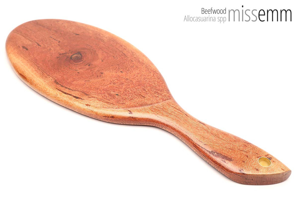 Unique handcrafted bdsm toys | Wooden spanking paddle | By kink artisan Miss Emm | Made from beefwood with brass details.