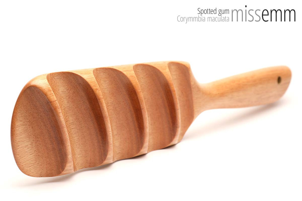 Unique handcrafted bdsm toys | Wooden spanking paddle | By kink artisan Miss Emm | Made from spotted gum with brass details.