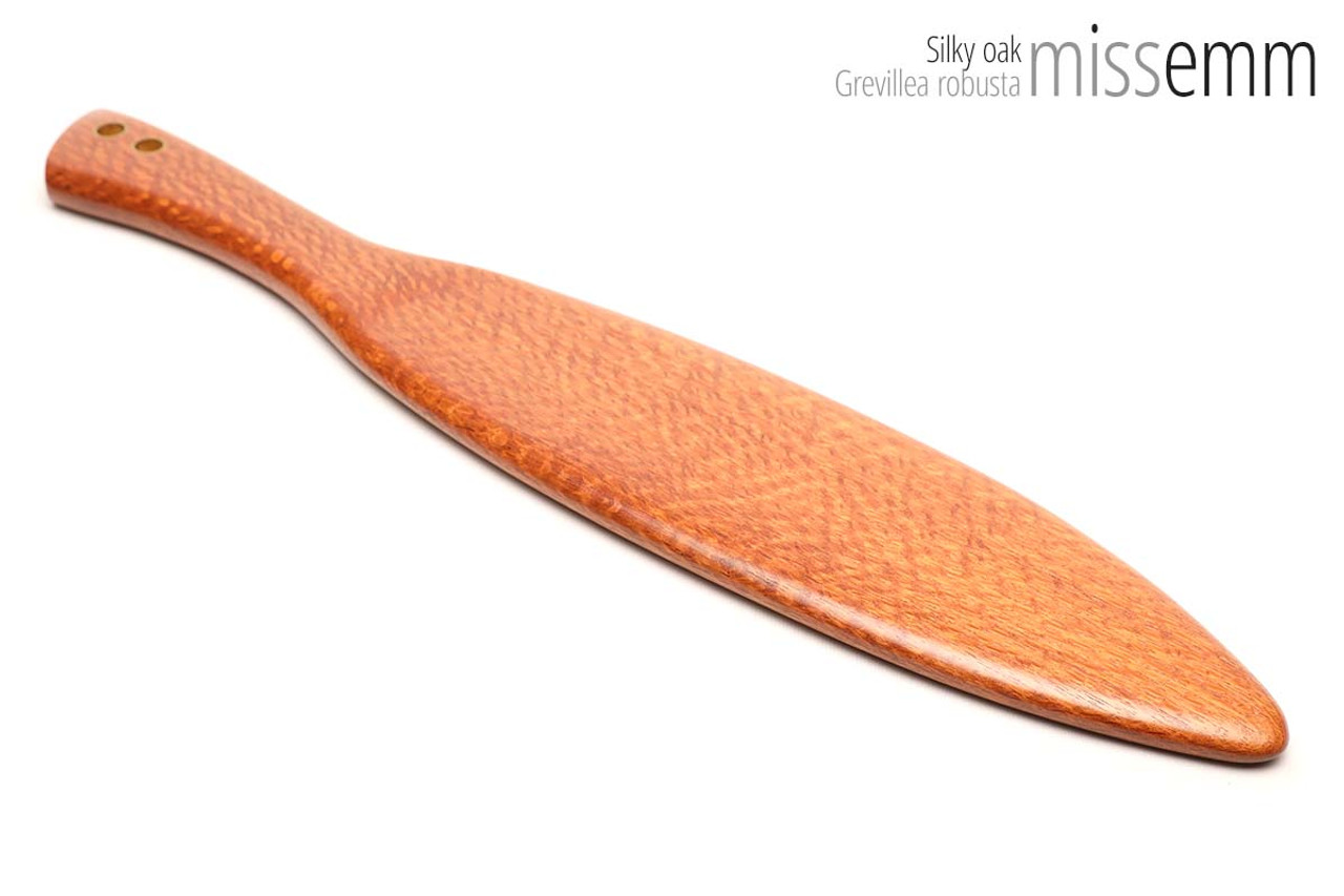 Unique handcrafted spanking toys | Wooden paddle | By kink artisan Miss Emm | Made from silky oak with brass details.