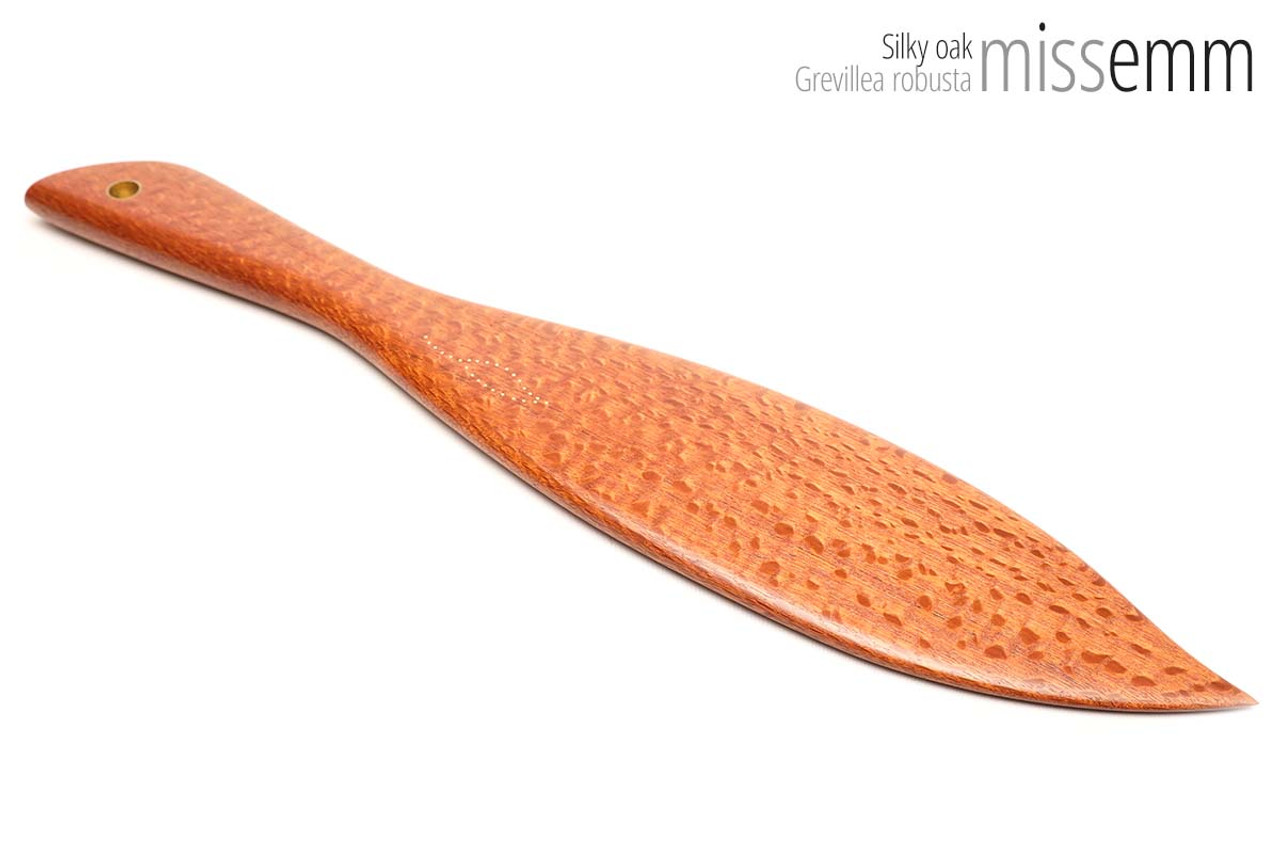 Unique handcrafted spanking toys | Wooden paddle | By kink artisan Miss Emm | Made from silky oak with brass details.