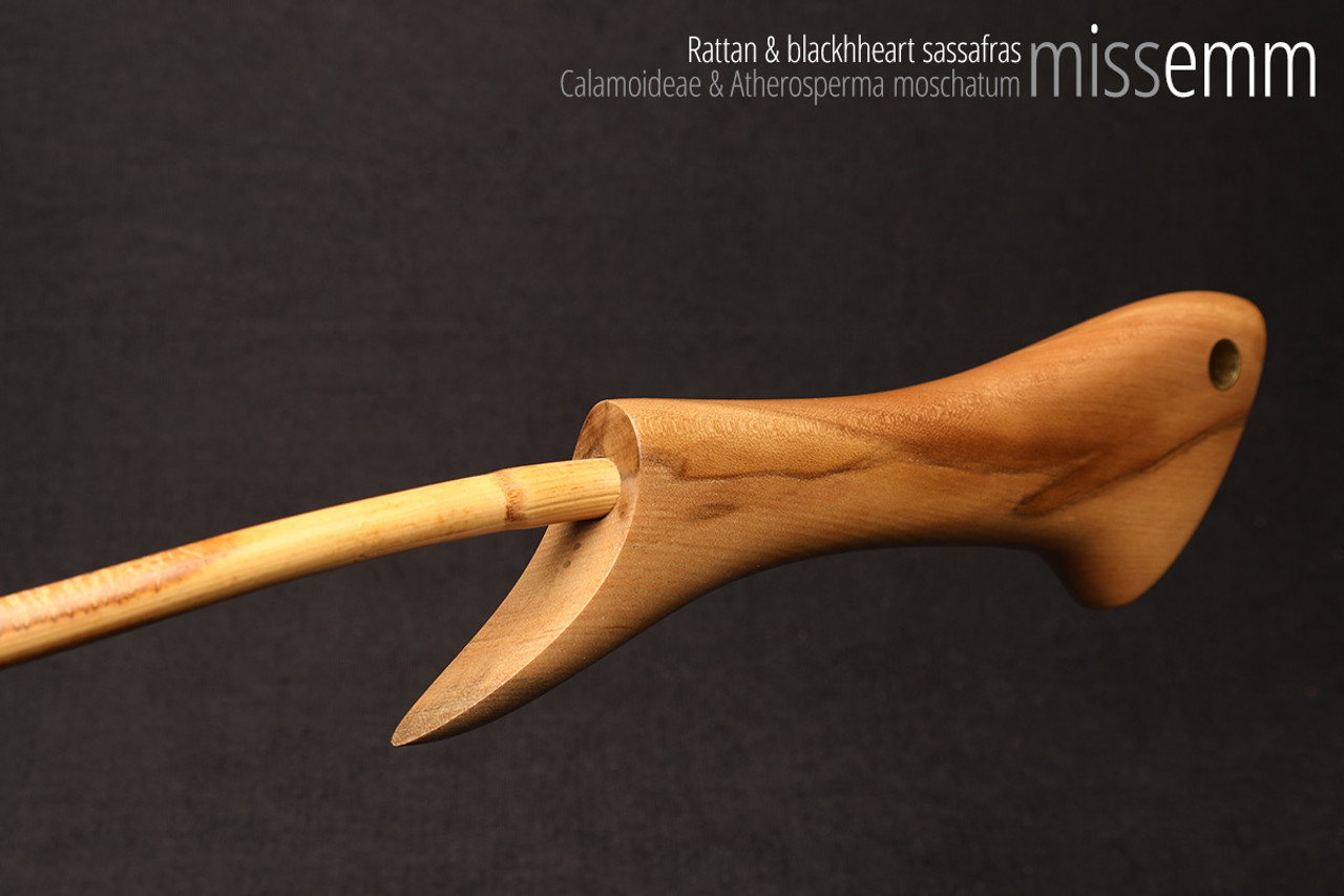 Handmade bdsm toys | Rattan cane | By kink artisan Miss Emm | The cane shaft is rattan cane and the handle has been handcrafted from blackheart sassafras with brass details.
