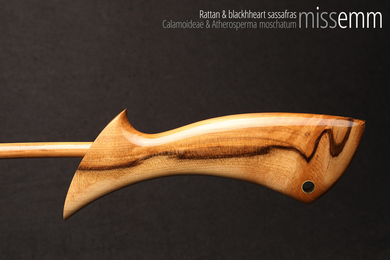 Handmade bdsm toys | Rattan cane | By kink artisan Miss Emm | The cane shaft is rattan cane and the handle has been handcrafted from blackheart sassafras with brass details.