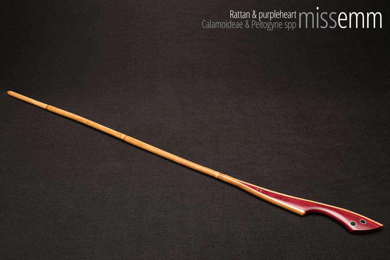 Handmade bdsm toys | Rattan cane | By kink artisan Miss Emm | The cane shaft is rattan cane and the handle has been handcrafted from purpleheart with aluminium details.