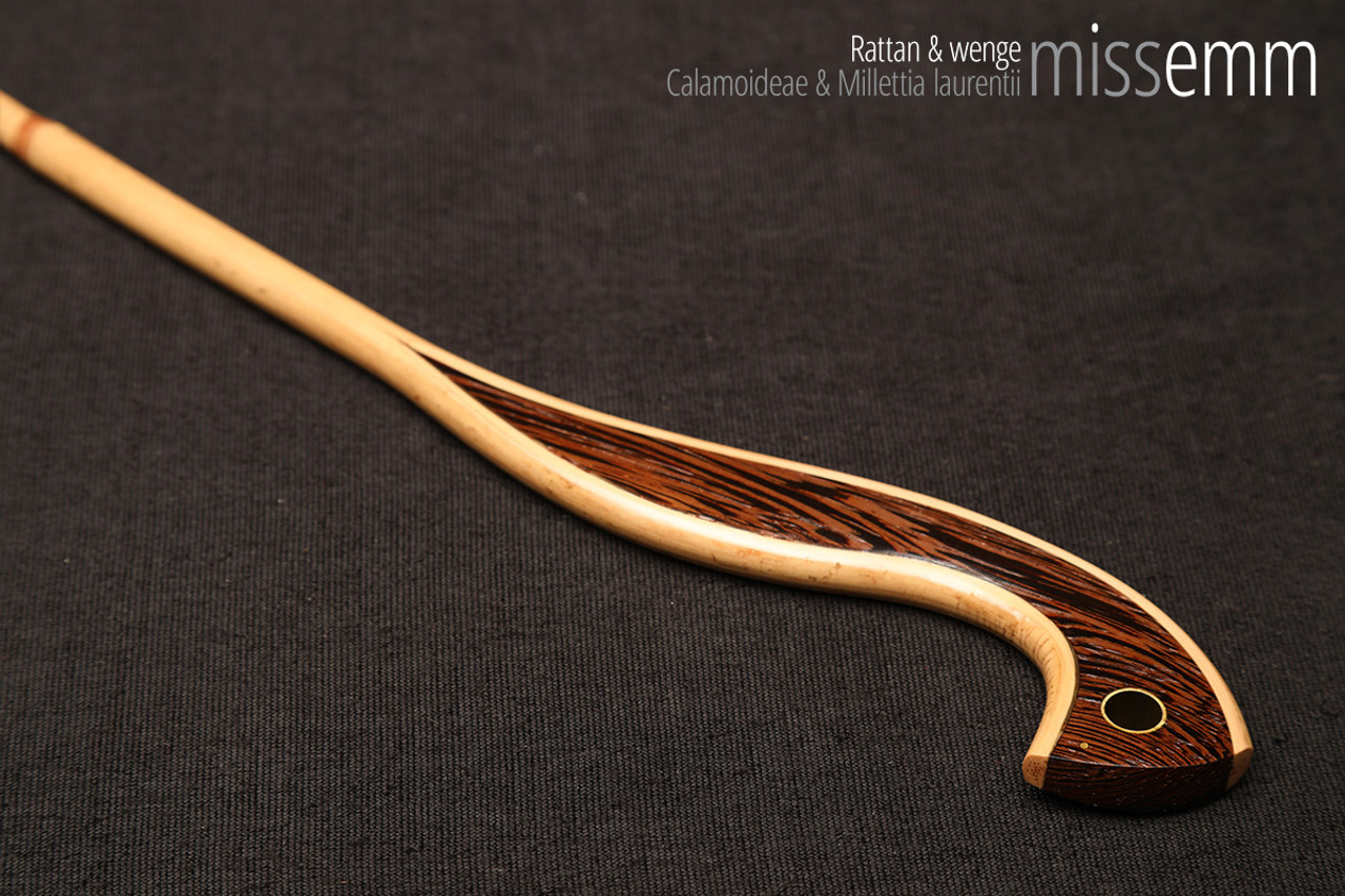 Handmade bdsm toys | Rattan cane | By kink artisan Miss Emm | The cane shaft is rattan cane and the handle has been handcrafted from wenge with brass details.