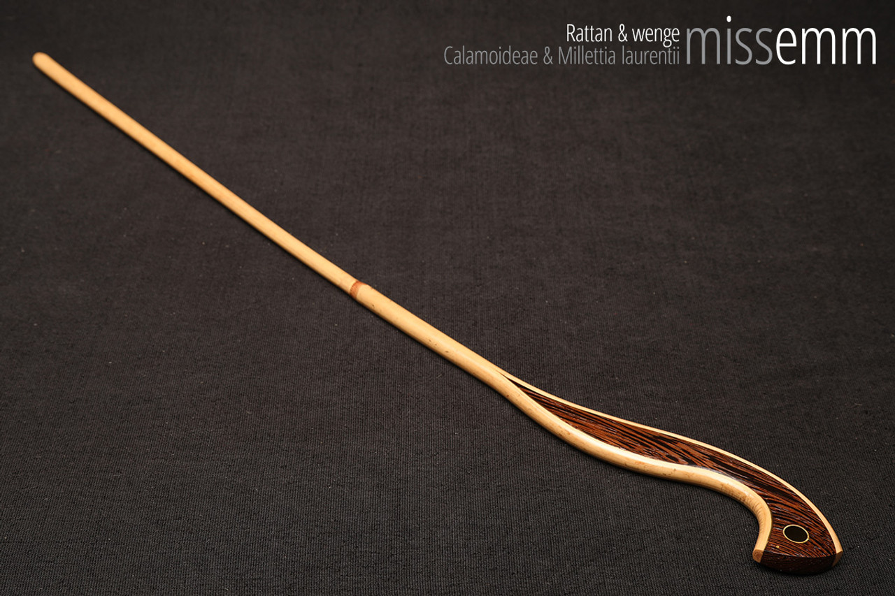 Handmade bdsm toys | Rattan cane | By kink artisan Miss Emm | The cane shaft is rattan cane and the handle has been handcrafted from wenge with brass details.