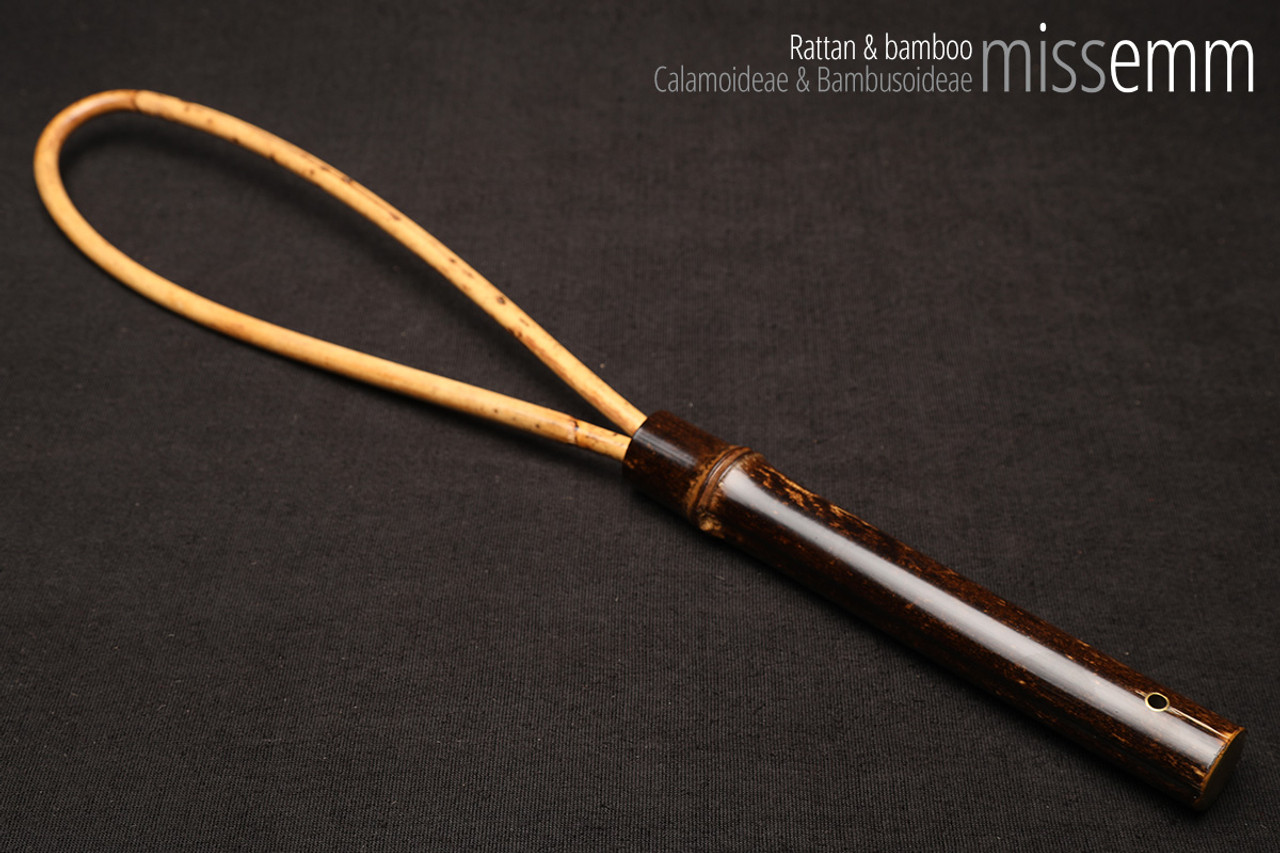 Unique bdsm spanking toys | Rattan loop cane | By kink artisan Miss Emm | The loop is made from rattan cane and the handle has been handcrafted from bamboo with brass details.