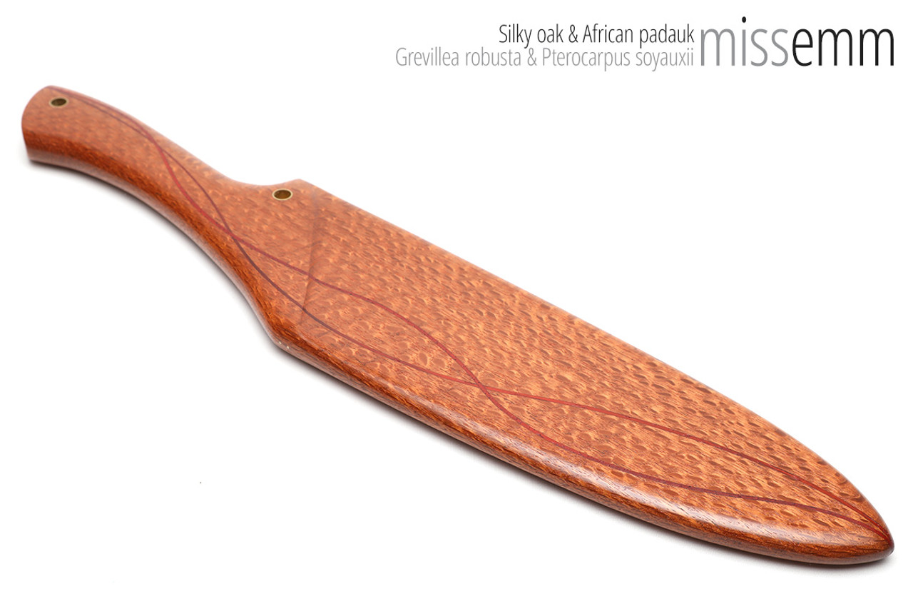 Unique handcrafted spanking toys | Wooden paddle | By kink artisan Miss Emm | Made from silky oak with brass details.