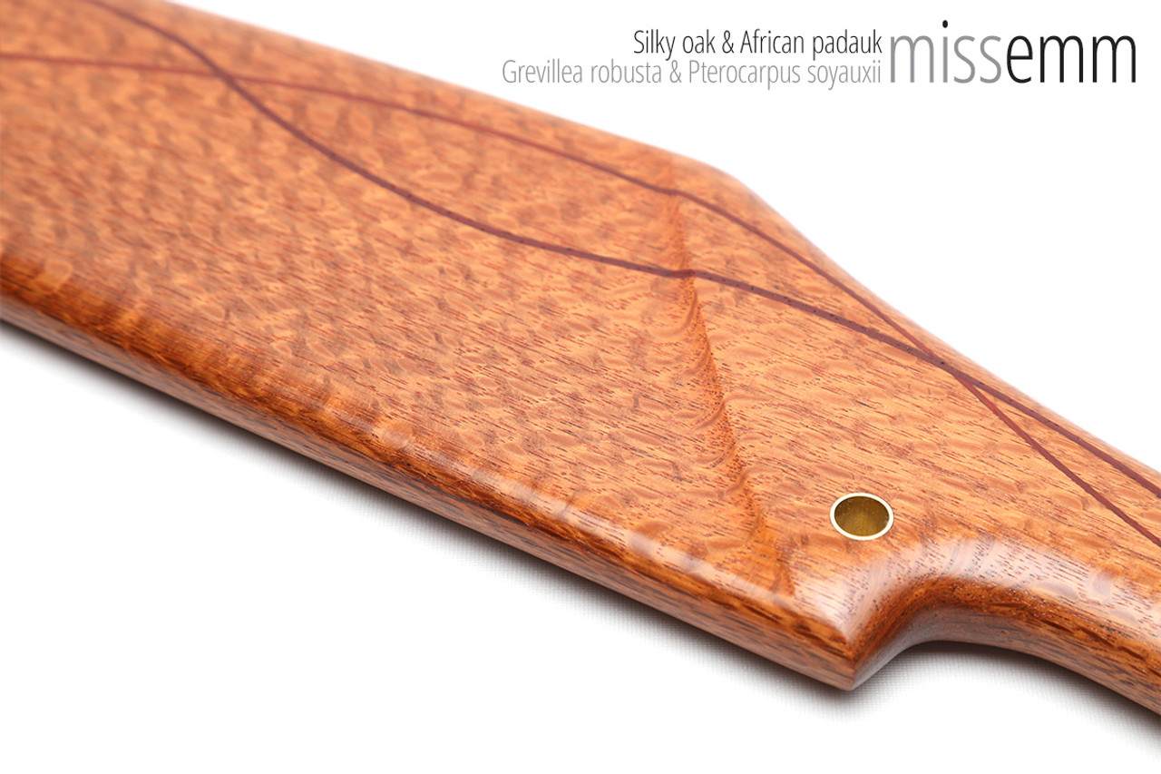 Unique handcrafted spanking toys | Wooden paddle | By kink artisan Miss Emm | Made from silky oak with brass details.