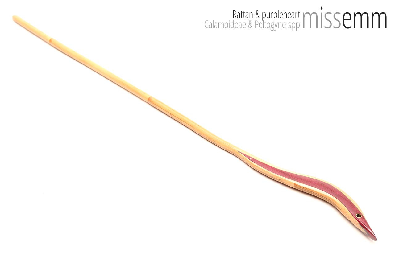 Handmade bdsm toys | Rattan cane | By kink artisan Miss Emm | The cane shaft is rattan cane and the handle has been handcrafted from purpleheart with brass details.