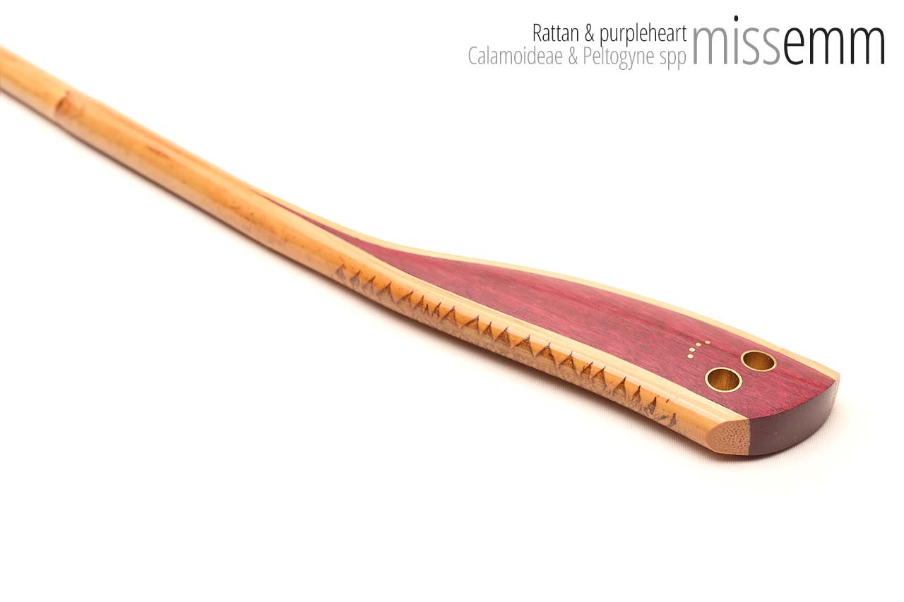 Handmade bdsm toys | Rattan cane | By kink artisan Miss Emm | The cane shaft is rattan cane and the handle has been handcrafted from purpleheart with brass details.