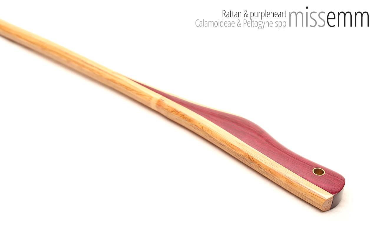 Handmade bdsm toys | Rattan cane | By kink artisan Miss Emm | The cane shaft is rattan cane and the handle has been handcrafted from purpleheart with brass details.