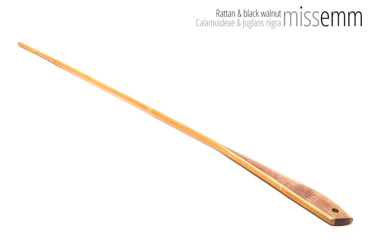 Handmade bdsm toys | Rattan cane | By kink artisan Miss Emm | The cane shaft is rattan cane and the handle has been handcrafted from black walnut with brass details.