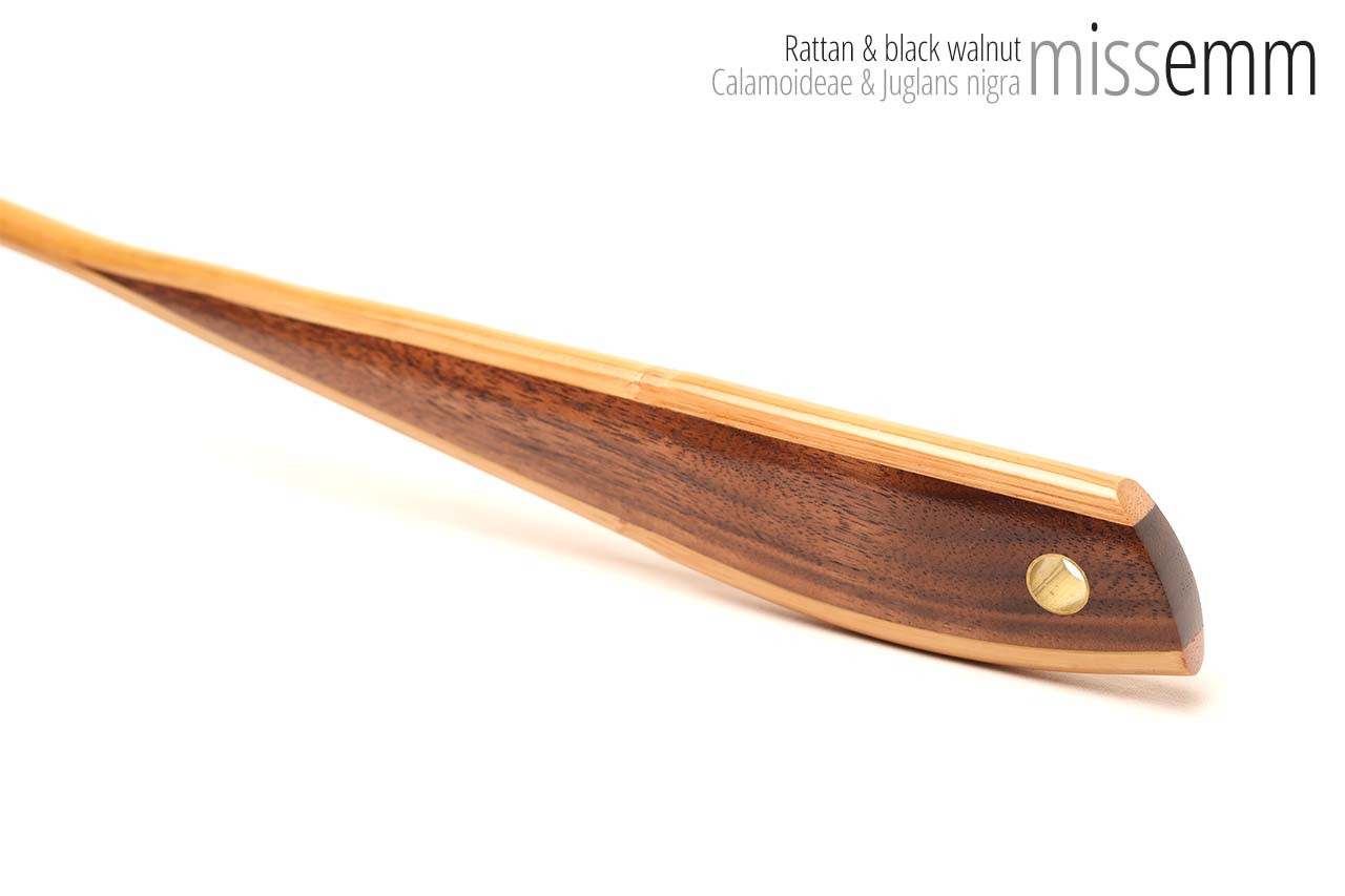 Handmade bdsm toys | Rattan cane | By kink artisan Miss Emm | The cane shaft is rattan cane and the handle has been handcrafted from black walnut with brass details.