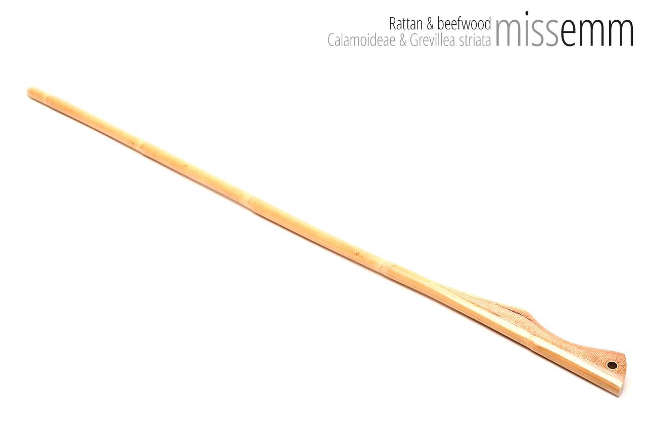 Handmade bdsm toys | Rattan cane | By kink artisan Miss Emm | The cane shaft is rattan cane and the handle has been handcrafted from beefwood with brass details.