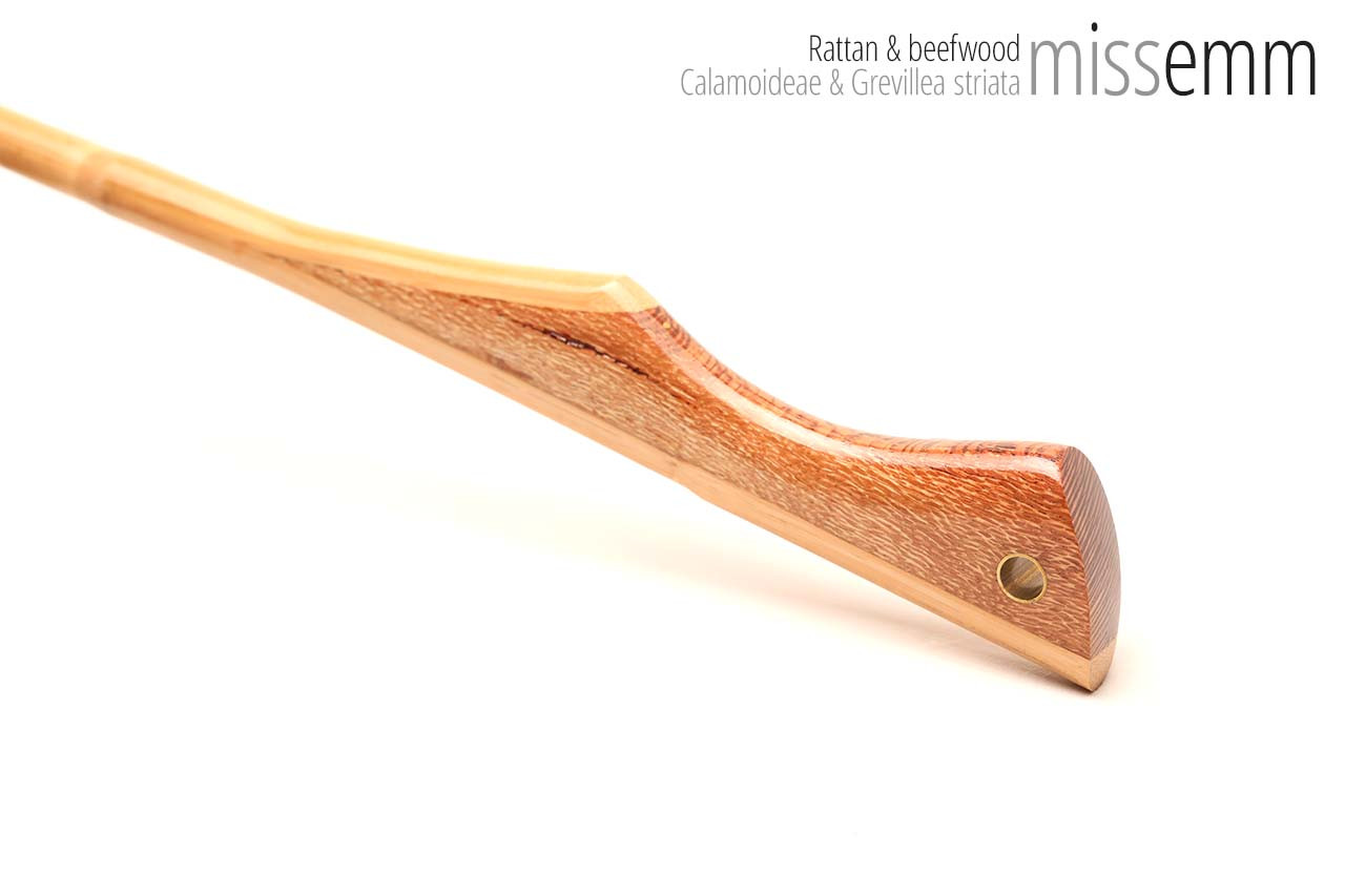 Handmade bdsm toys | Rattan cane | By kink artisan Miss Emm | The cane shaft is rattan cane and the handle has been handcrafted from beefwood with brass details.