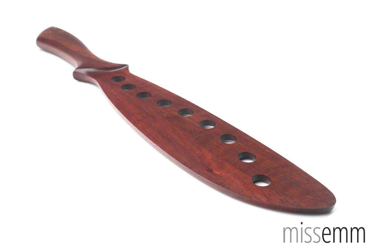 Wooden spanking paddle with holes, made from Jarrah. Angled view back side