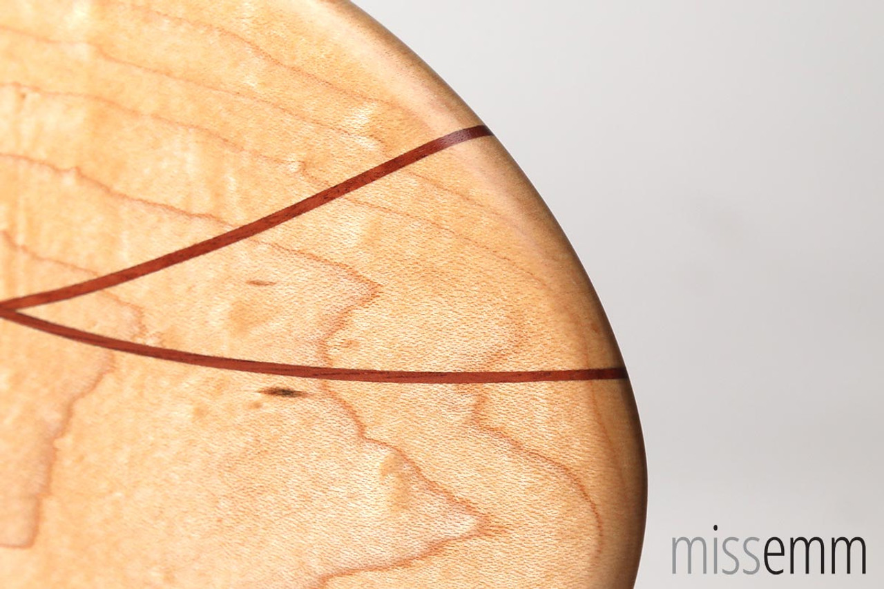 Detail from the tip of this Rock Maple paddle with Jarrah lines.