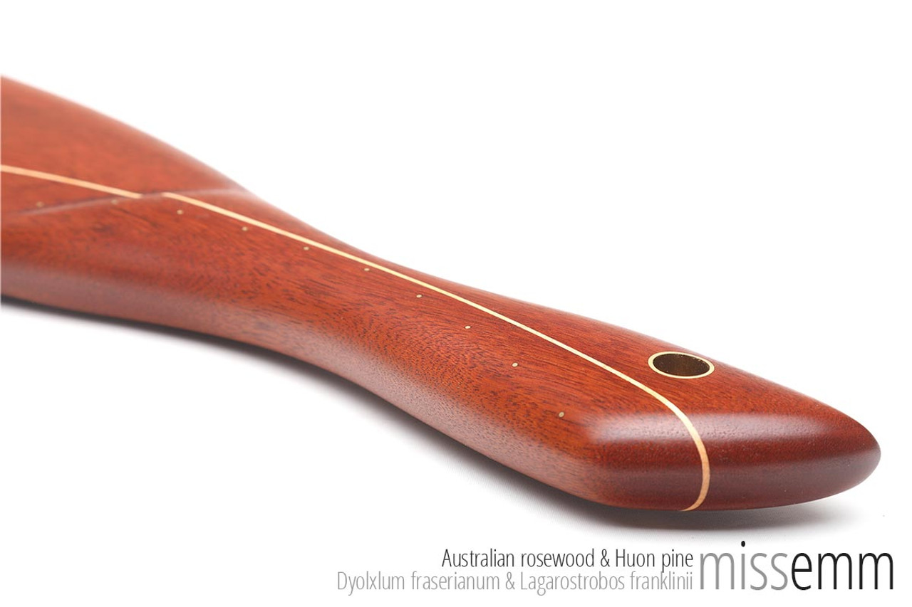Unique spanking toys | Ridged wooden paddle | By fetish artisan Miss Emm | This stunning spanking paddle is made from Australian rosewood with a Huon pine line and brass details. It has a gently ridged face and a smooth face for adding an extra sensation to your impact play. 