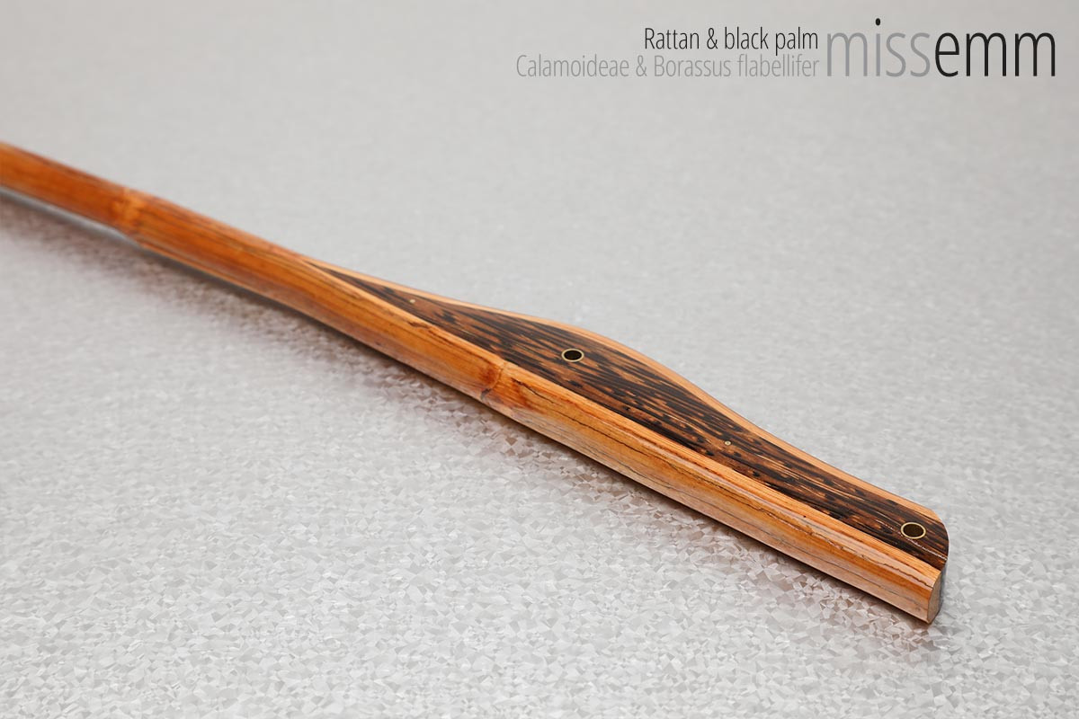Unique handcrafted bdsm toys | Rattan spanking cane | By kink artisan Miss Emm | Made from rattan and black palm with brass details. If you like your kink toys unique, stylish, and functional then a Miss Emm cane will make the perfect addition to your collection.