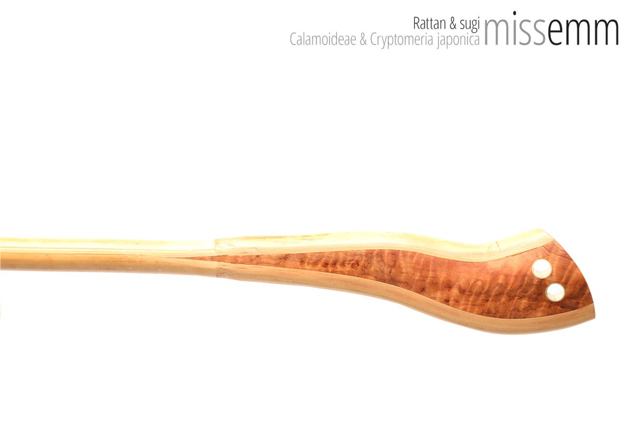 Unique handcrafted bdsm toys | Rattan spanking cane | By kink artisan Miss Emm | The shaft is rattan cane and the handle has been handcrafted from Japanese cedar with brass details.