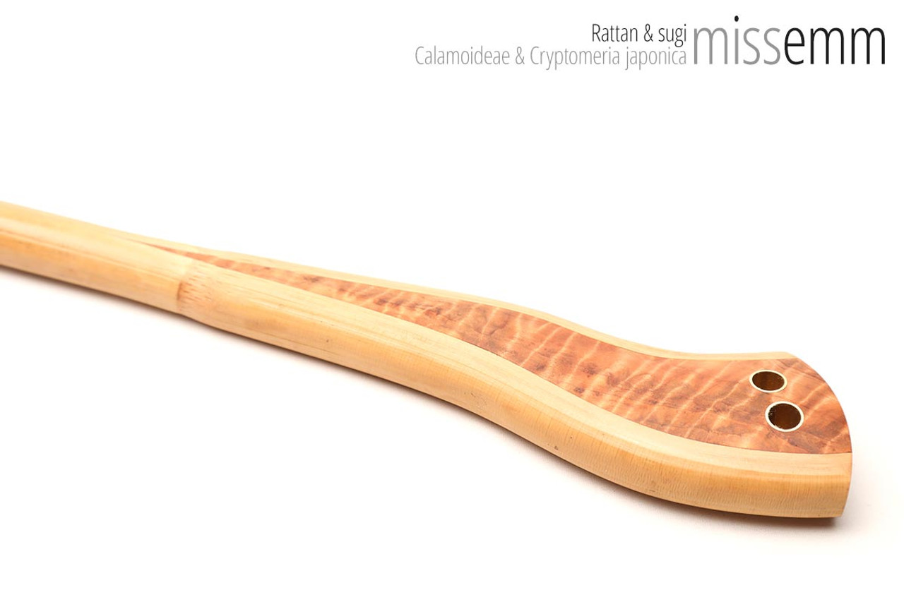 Unique handcrafted bdsm toys | Rattan spanking cane | By kink artisan Miss Emm | The shaft is rattan cane and the handle has been handcrafted from Japanese cedar with brass details.