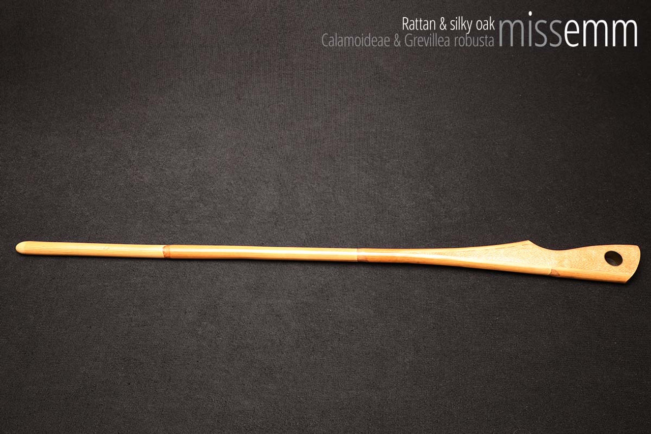 Unique handcrafted bdsm toys | Rattan spanking cane | By kink artisan Miss Emm | The shaft is rattan cane and the handle has been handcrafted from silky oak with brass details.