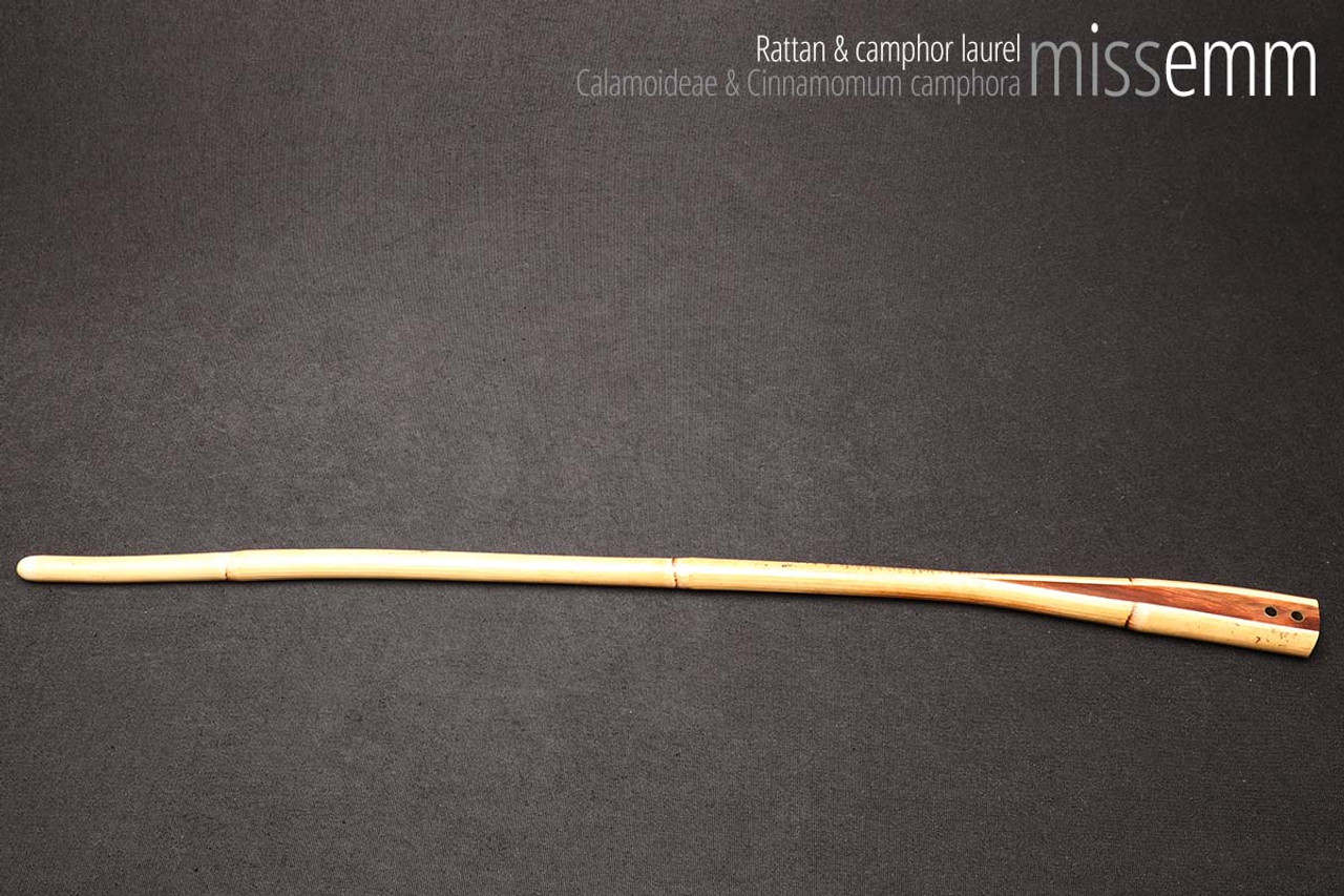 Unique handcrafted bdsm toys | Rattan spanking cane | By kink artisan Miss Emm | The shaft is rattan cane and the handle has been handcrafted from camphor laurel with brass details.