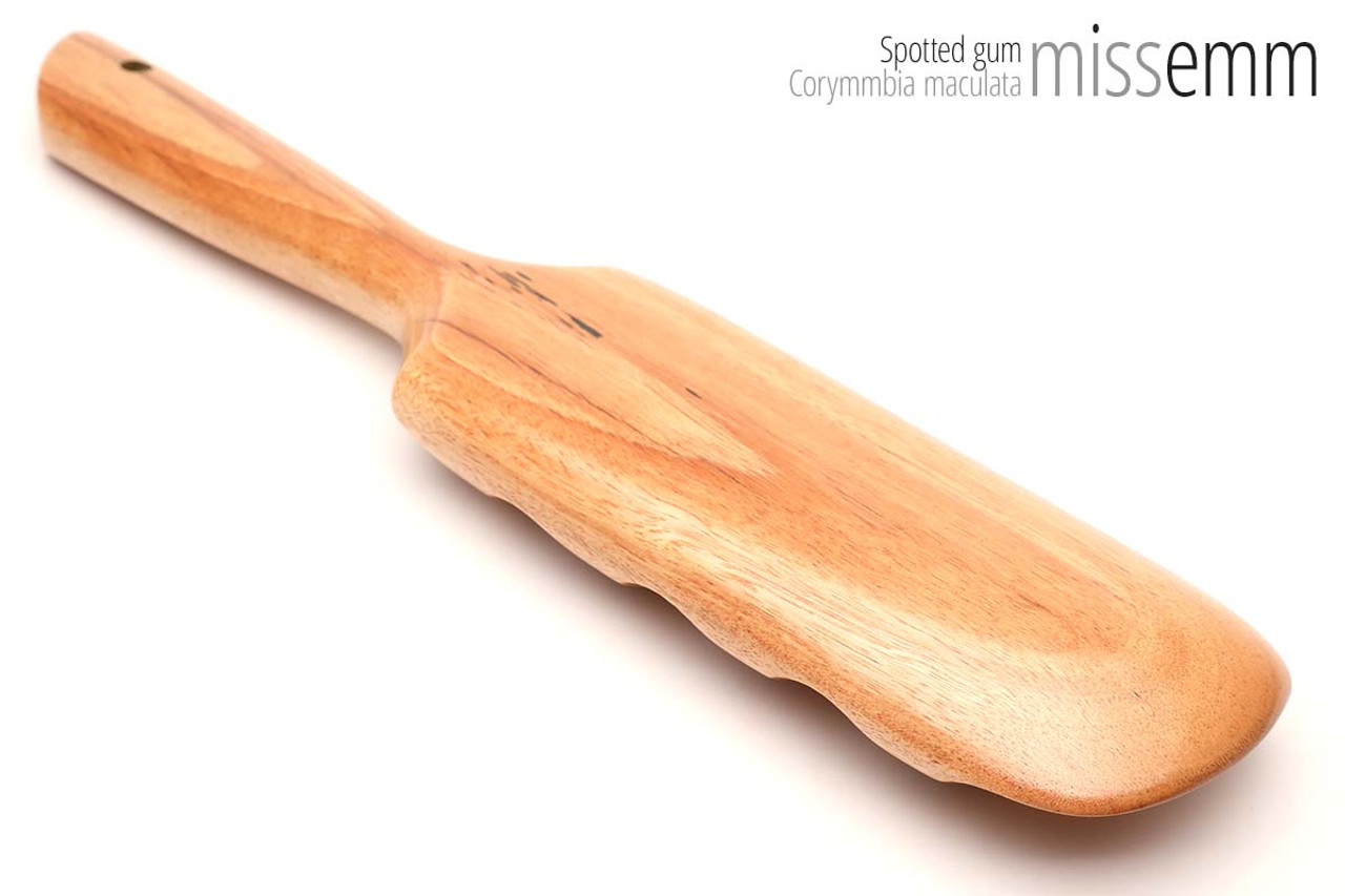 Unique handcrafted bdsm toys | Wooden spanking paddle | By kink artisan Miss Emm | Made from spotted gum with brass details.