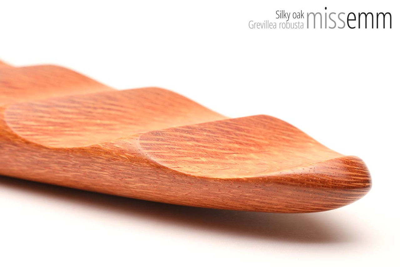 Unique handcrafted bdsm toys | Wooden spanking paddle | By kink artisan Miss Emm | Made from Silky oak with brass details.