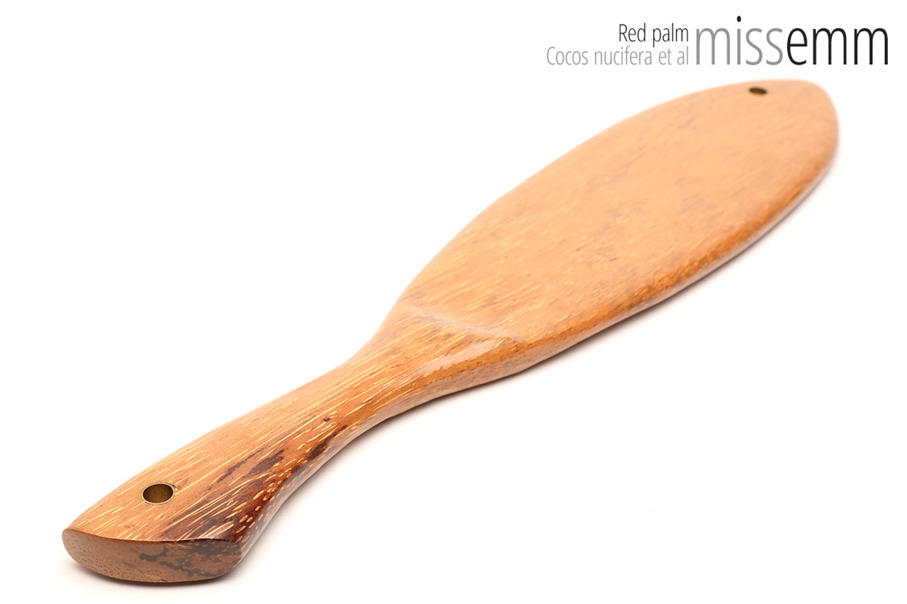 Unique handcrafted bdsm toys | Wooden spanking paddle | By kink artisan Miss Emm | Made from red palm with brass details.