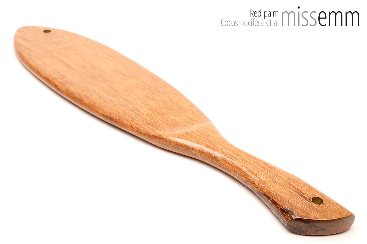 Unique handcrafted bdsm toys | Wooden spanking paddle | By kink artisan Miss Emm | Made from red palm with brass details.