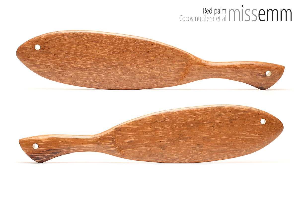 Unique handcrafted bdsm toys | Wooden spanking paddle | By kink artisan Miss Emm | Made from red palm with brass details.