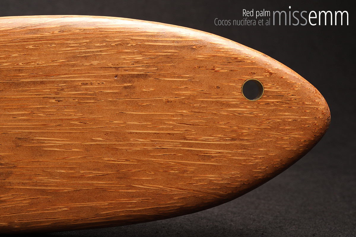 Unique handcrafted bdsm toys | Wooden spanking paddle | By kink artisan Miss Emm | Made from red palm with brass details.