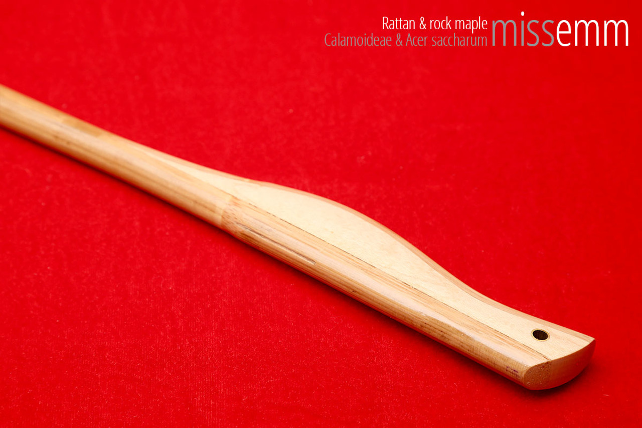 Handmade bdsm toys | Rattan cane | By kink artisan Miss Emm | The cane shaft is rattan cane and the handle has been handcrafted from rock maple with brass details.